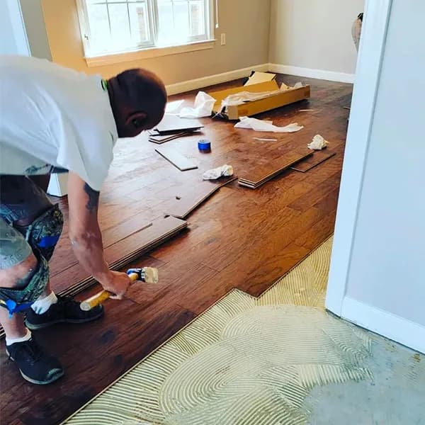 Olivas Hardwood Flooring team working on a hardwood floor refinishing project
