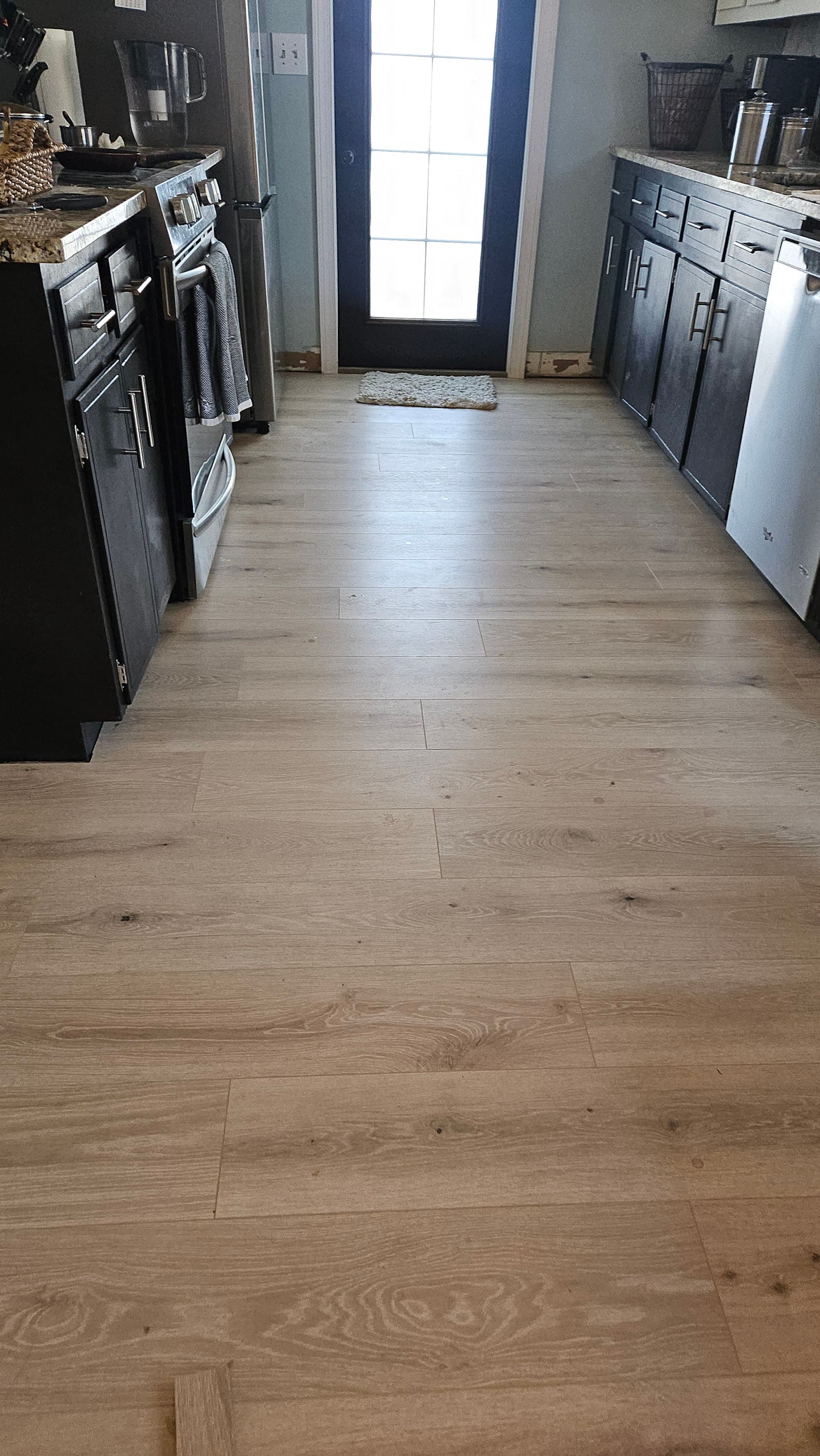 Engineered hardwood flooring in Lawrenceville GA — wide plank natural oak kitchen finished