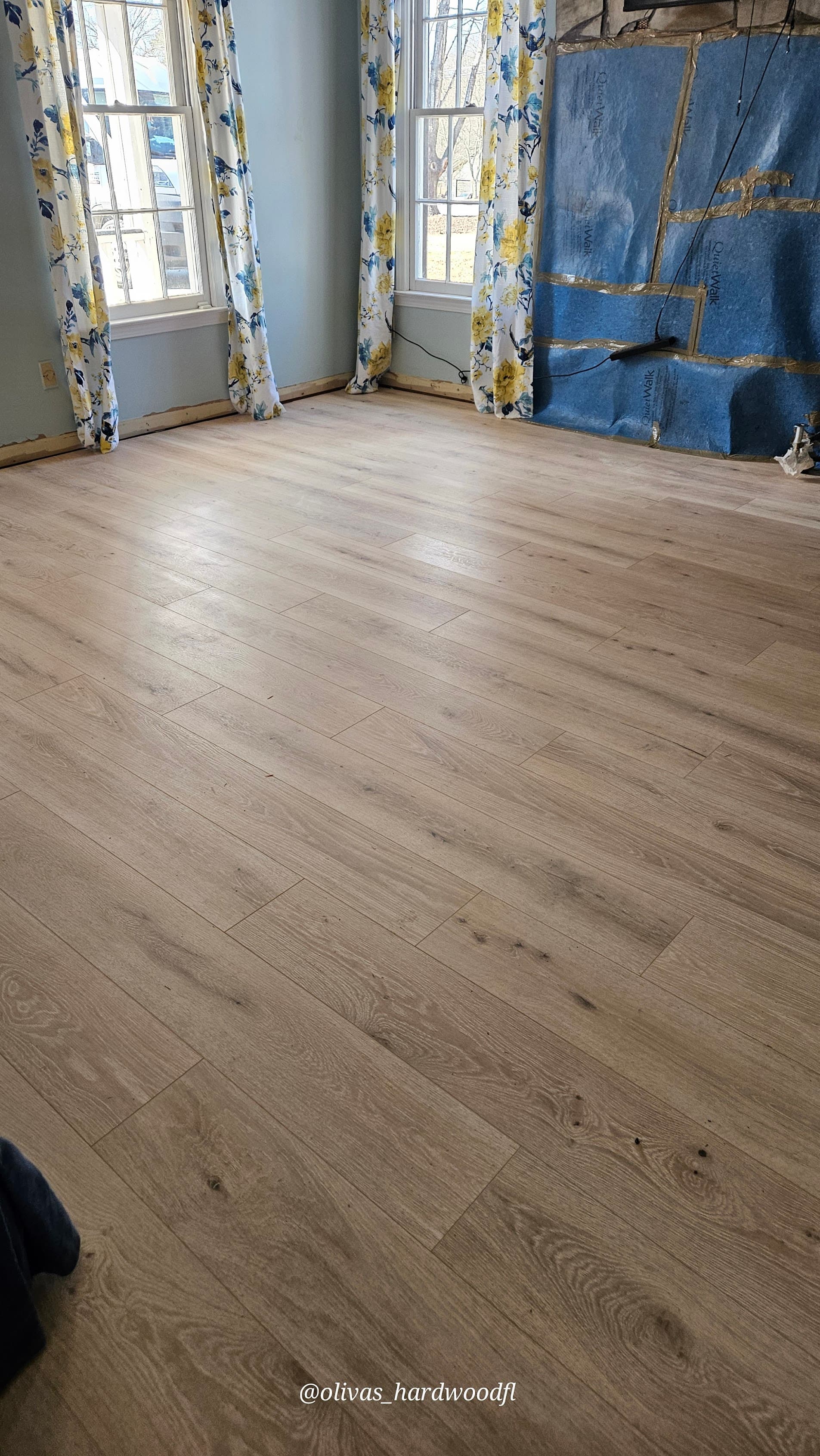Engineered hardwood floor installation in Duluth GA — wide plank natural oak living room in progress