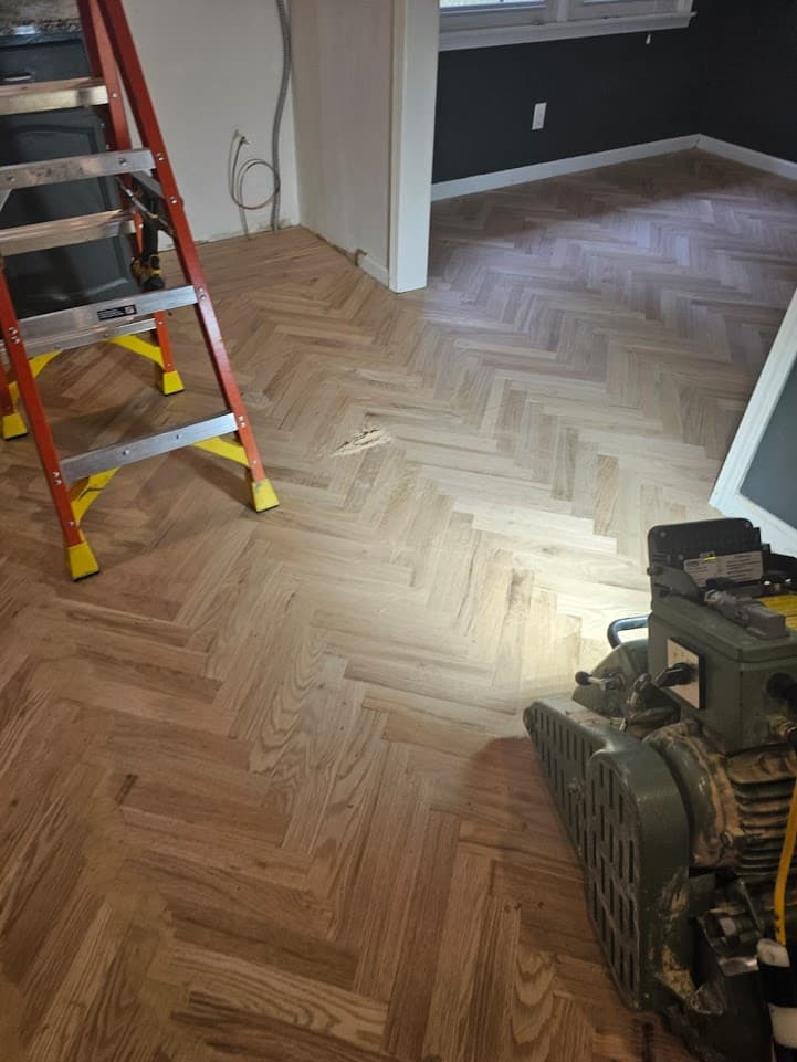 Herringbone hardwood floor sanding in Duluth GA — red oak parquet sanded smooth with drum sander