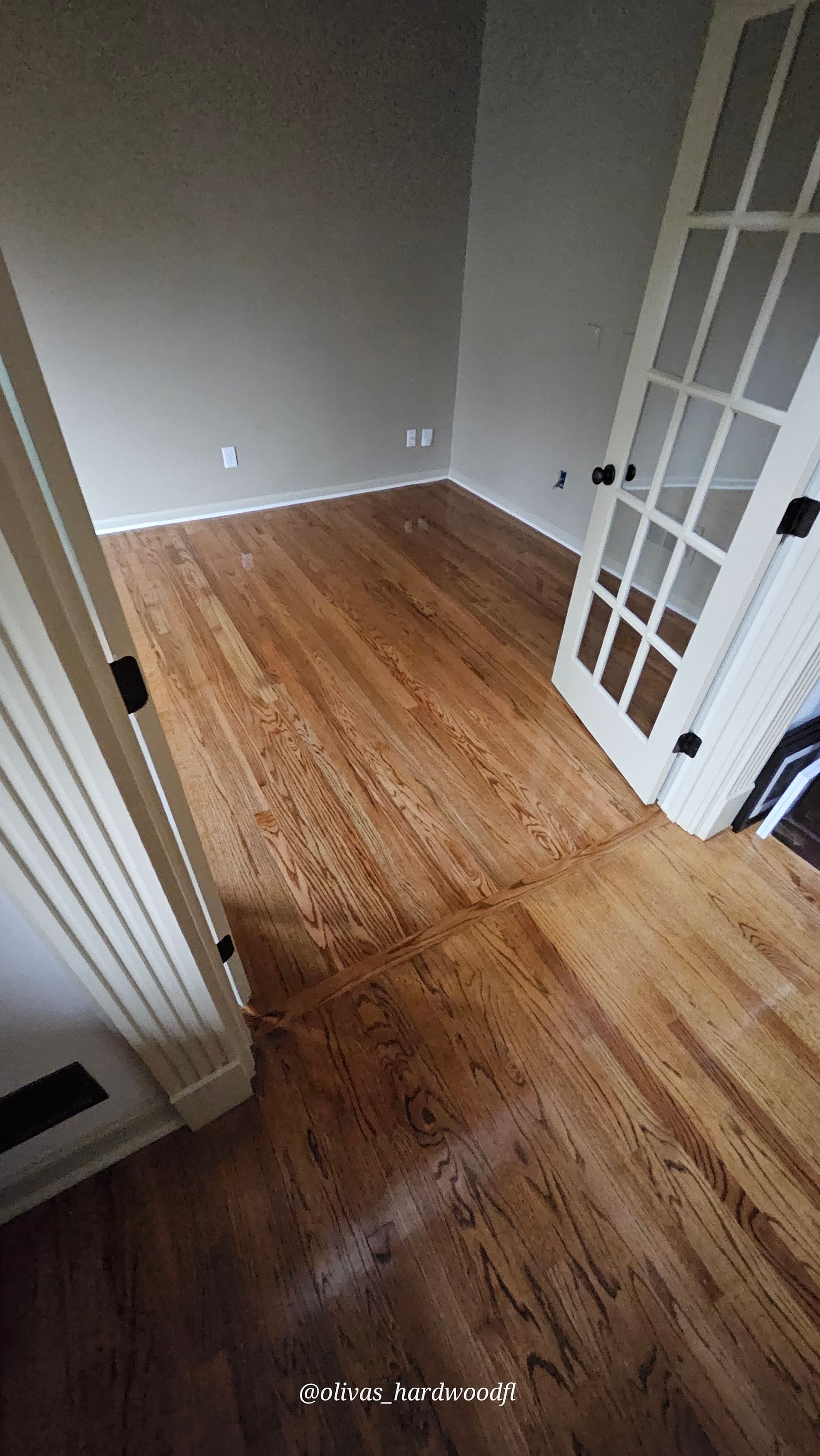 Hardwood floor refinishing in Decatur GA — gunstock stain red oak home office with French doors