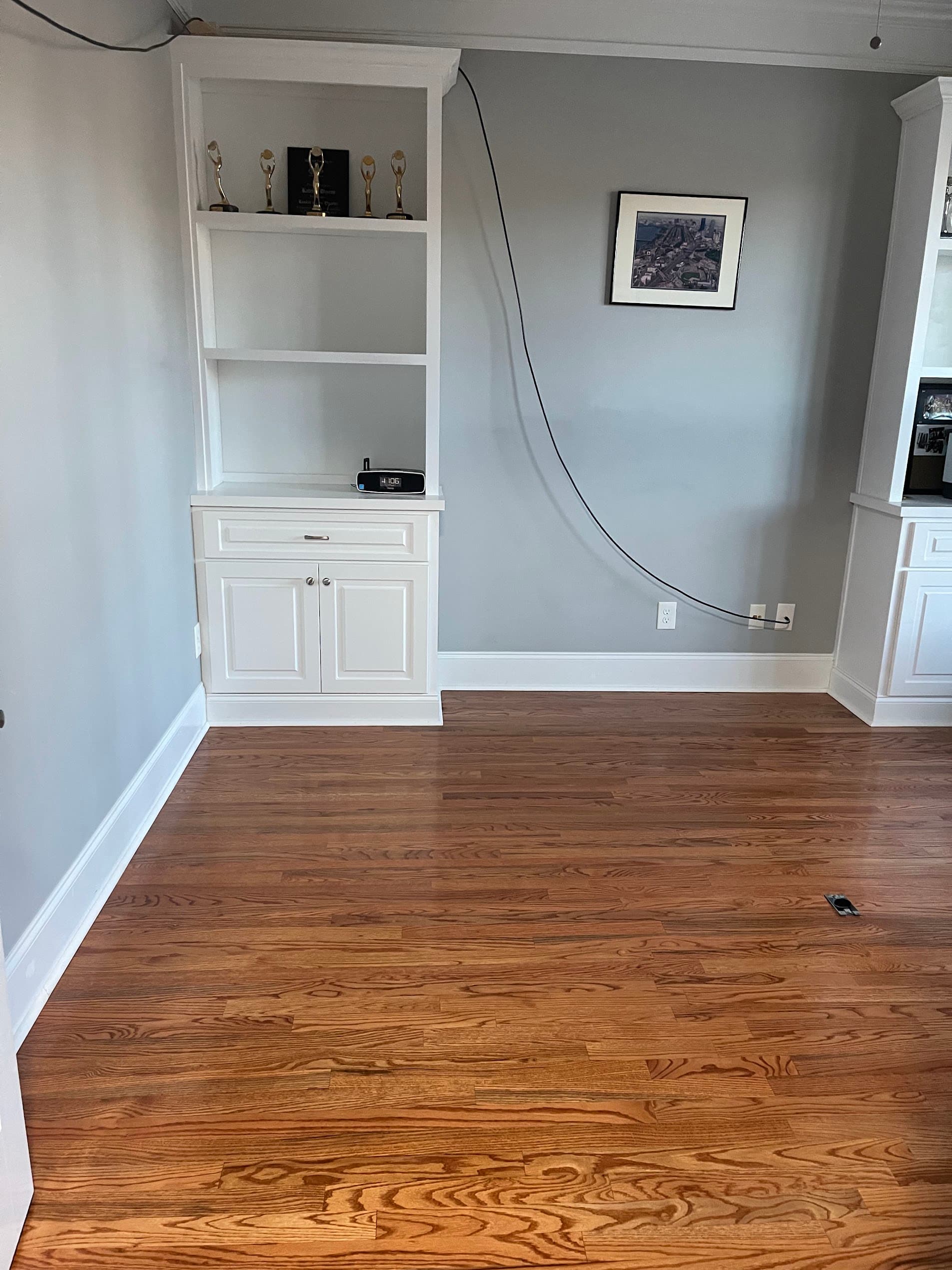 Hardwood floor refinishing in Gwinnett County GA — gunstock stain red oak den with built-in shelves