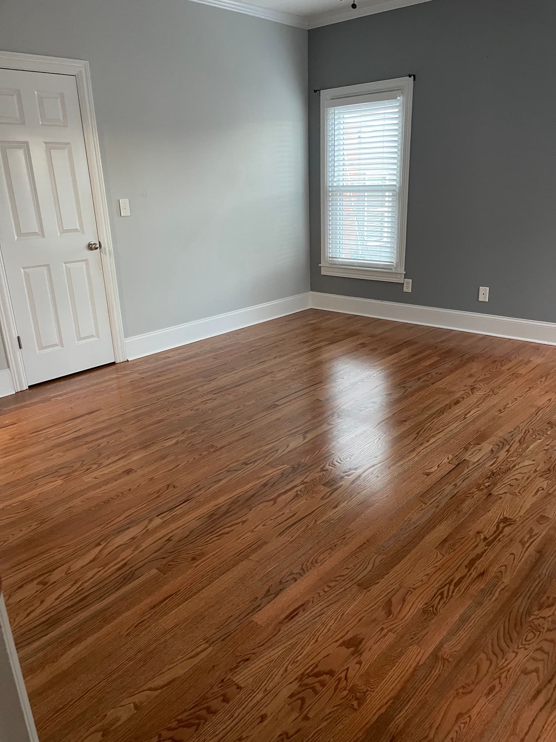 Hardwood floor refinishing in Atlanta GA — gunstock stain red oak bedroom with gray walls