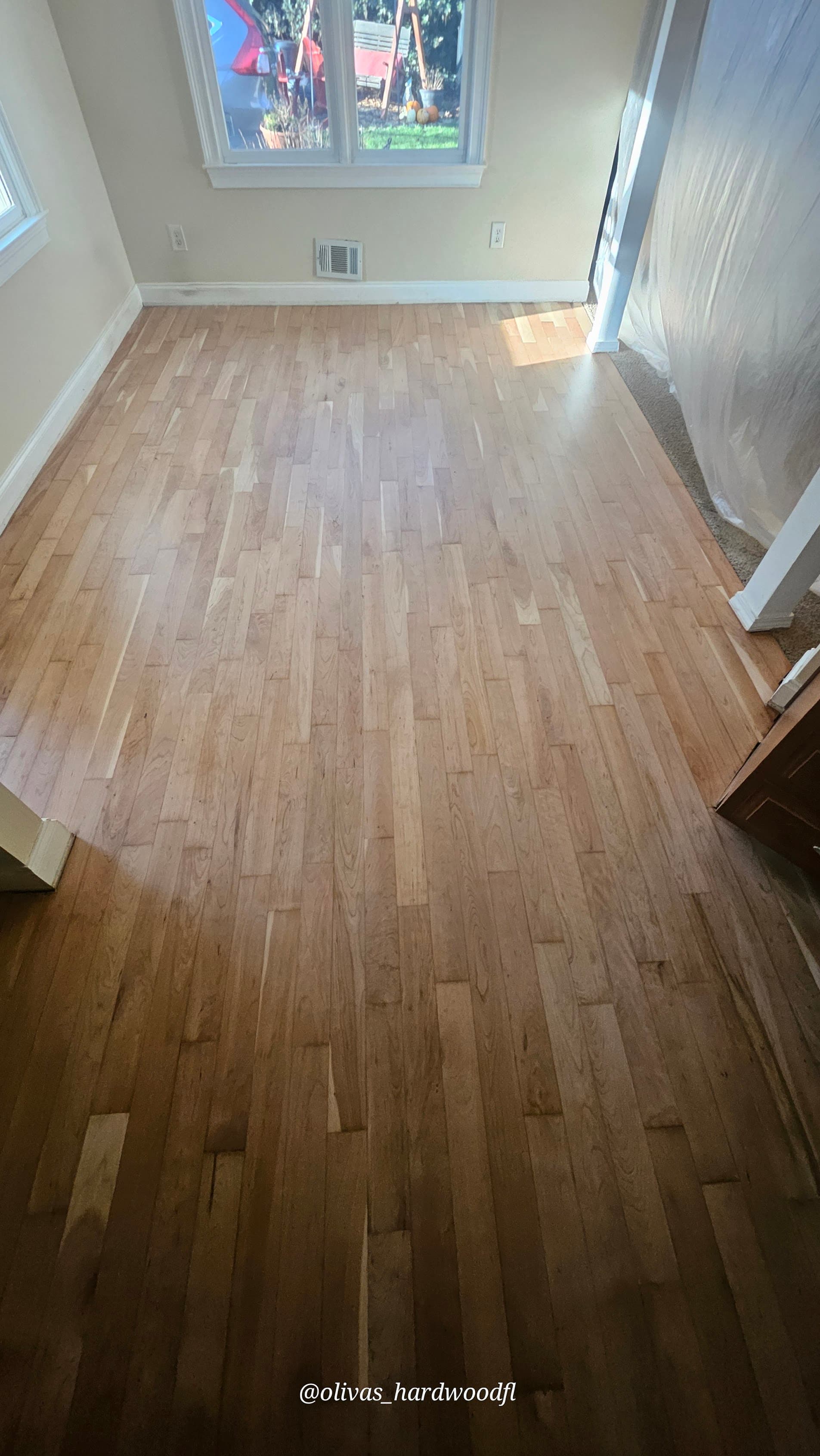 Hardwood floor refinishing in Marietta GA — natural honey oak bedroom refinished to like-new condition