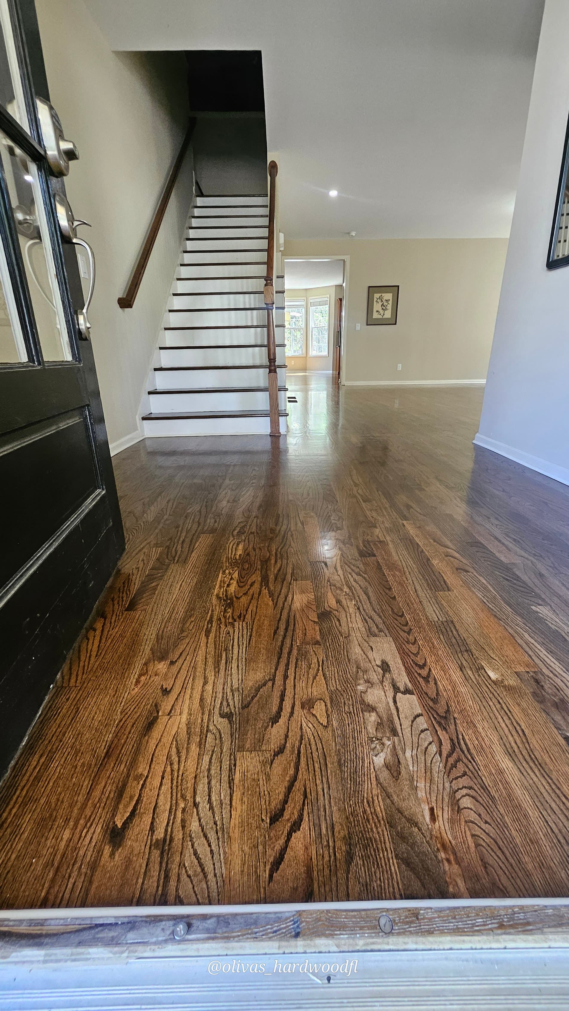 Hardwood floor refinishing in Lawrenceville GA — dark espresso stain oak foyer and entry