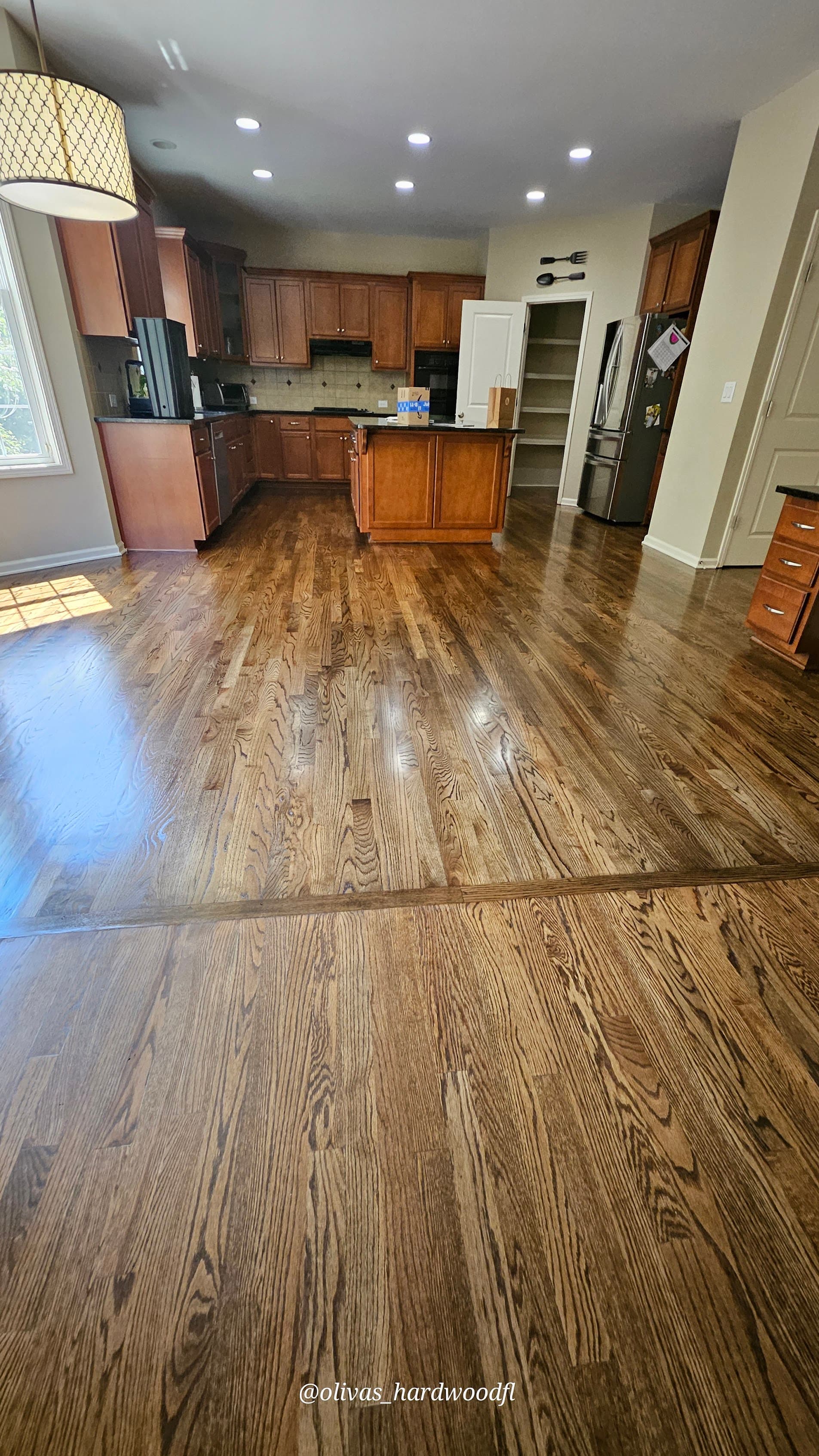 Hardwood floor refinishing in Johns Creek GA — dark brown stain oak open kitchen with island
