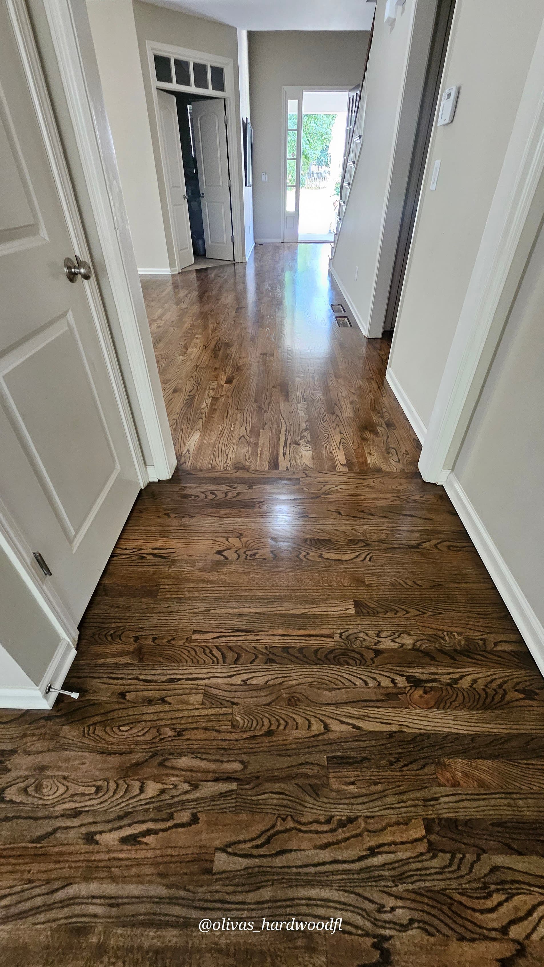 Hardwood floor refinishing in Duluth GA — dark espresso stain oak hallway and entry