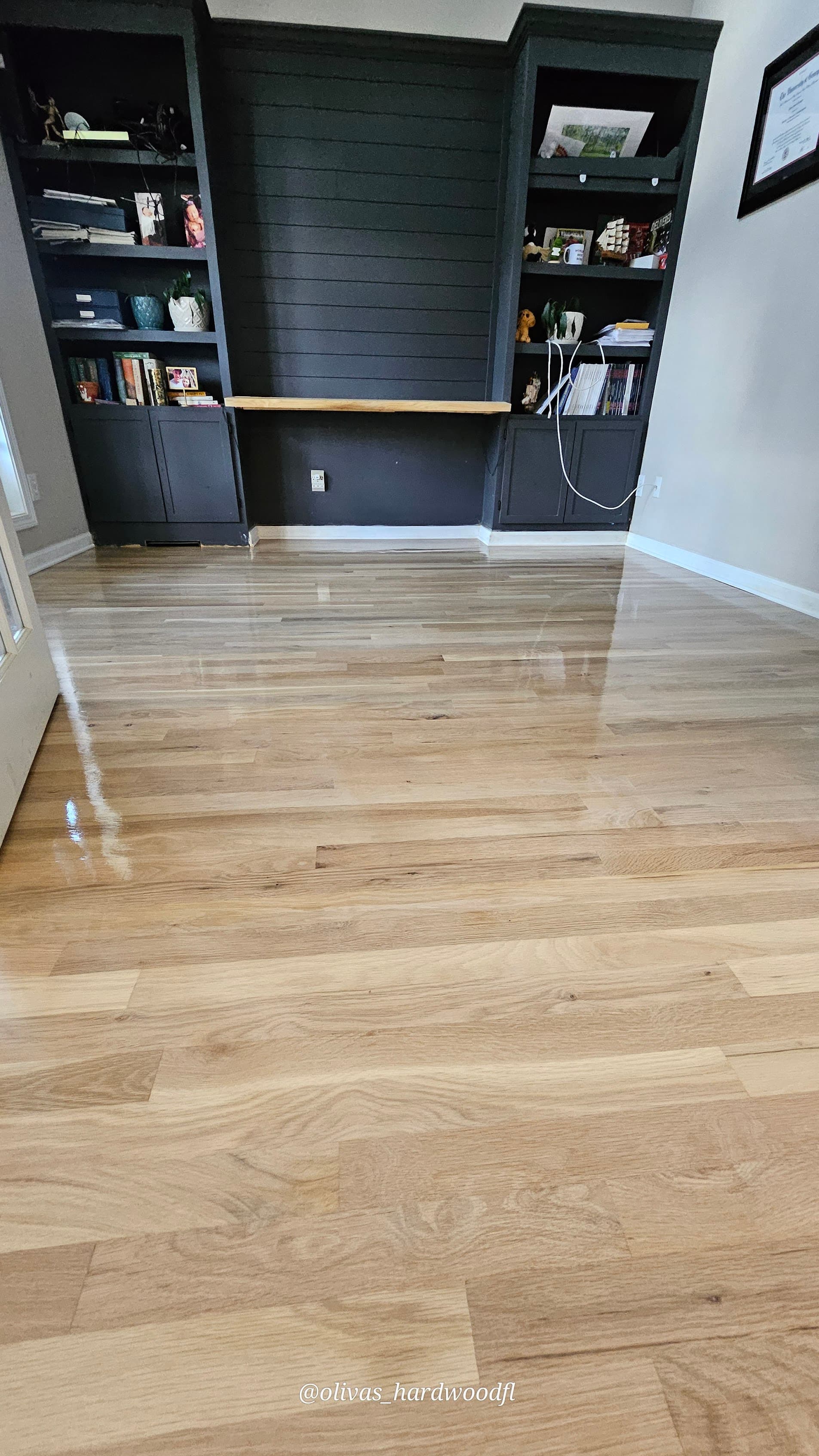 Hardwood floor refinishing in Alpharetta GA — natural oak high-gloss home office with dark built-in shelving