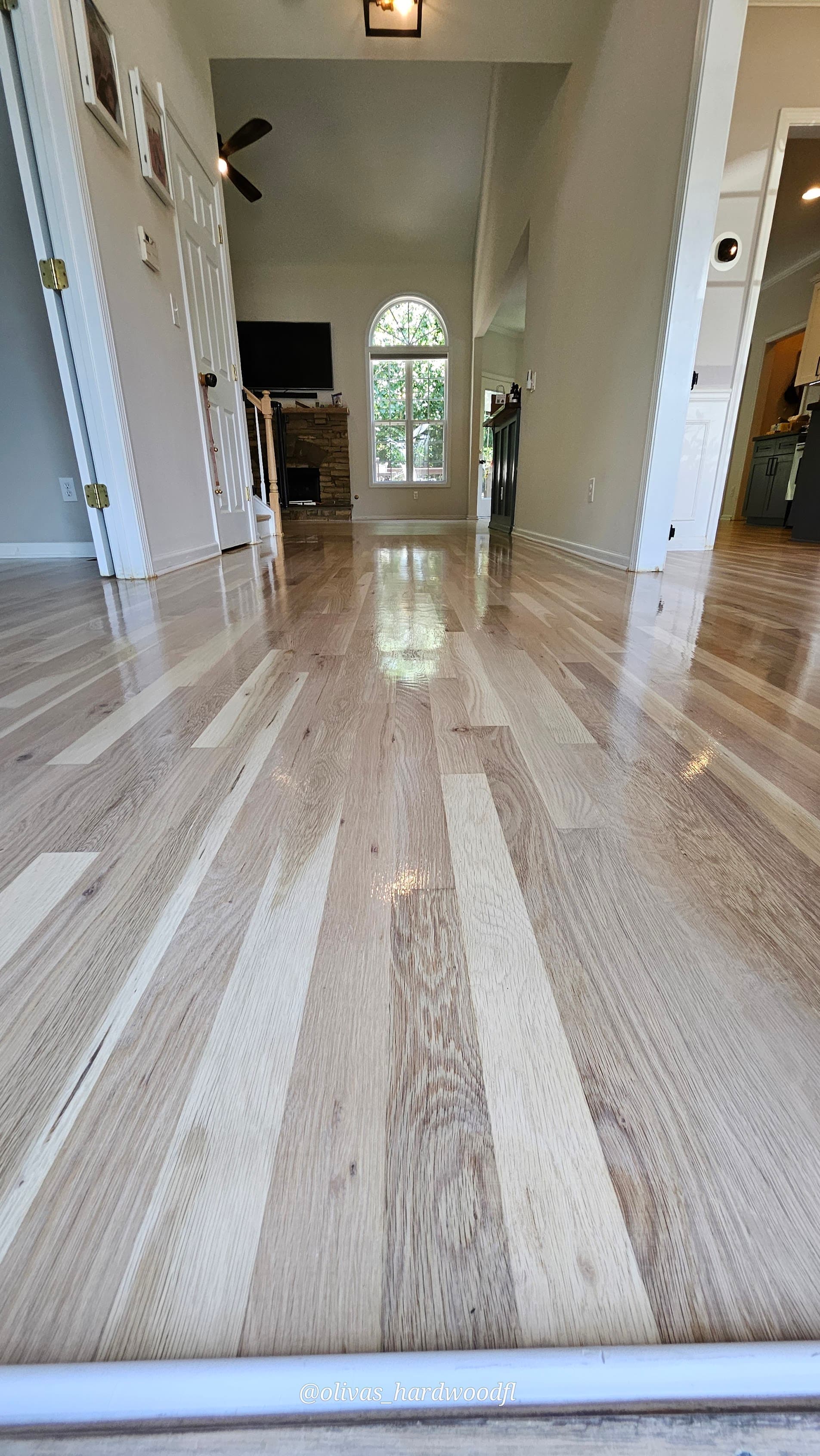 Hardwood floor refinishing in Sandy Springs GA — natural white oak high-gloss foyer and hallway