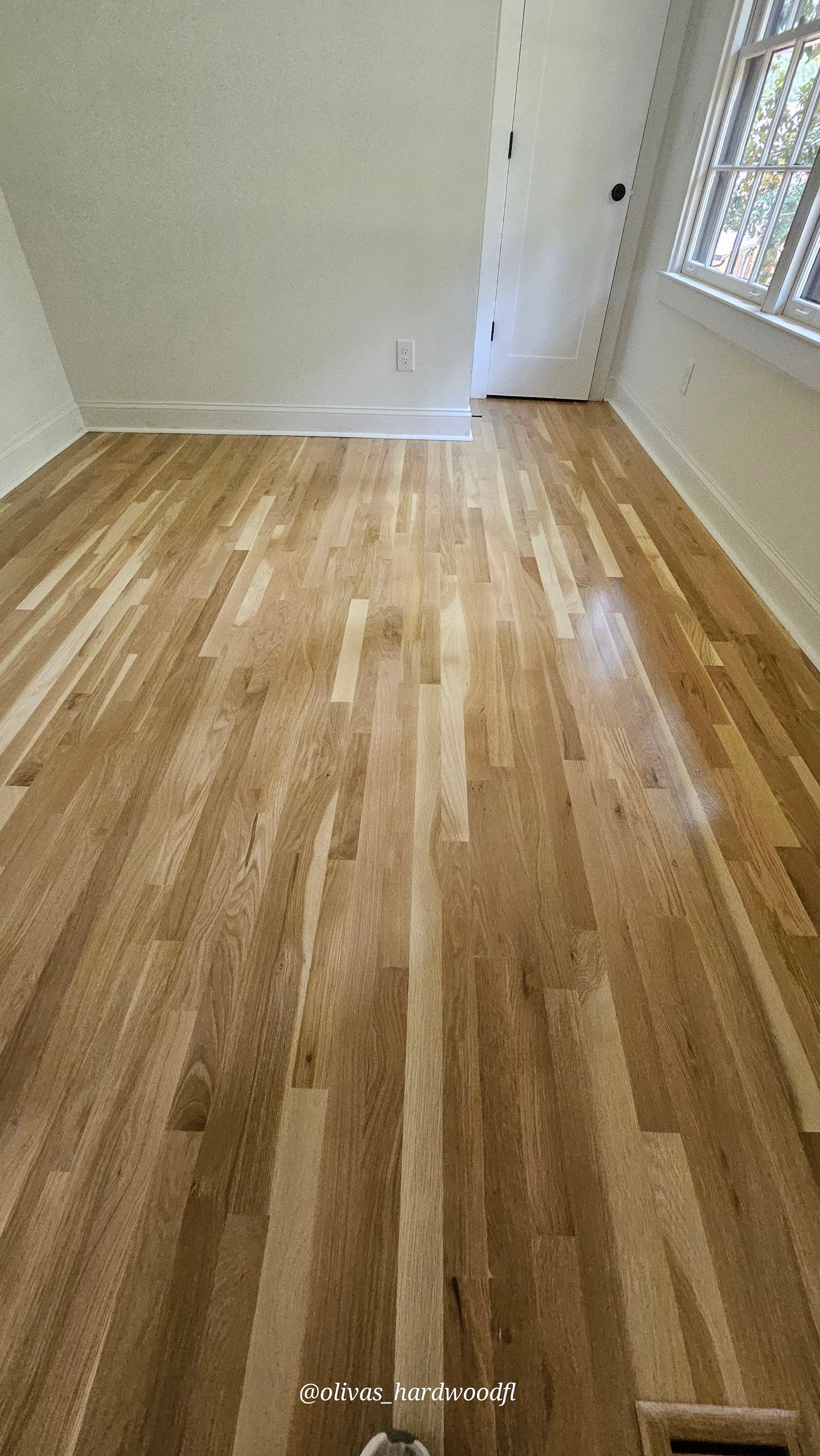 Hardwood floor refinishing in Atlanta GA — natural white oak high-gloss bedroom floors