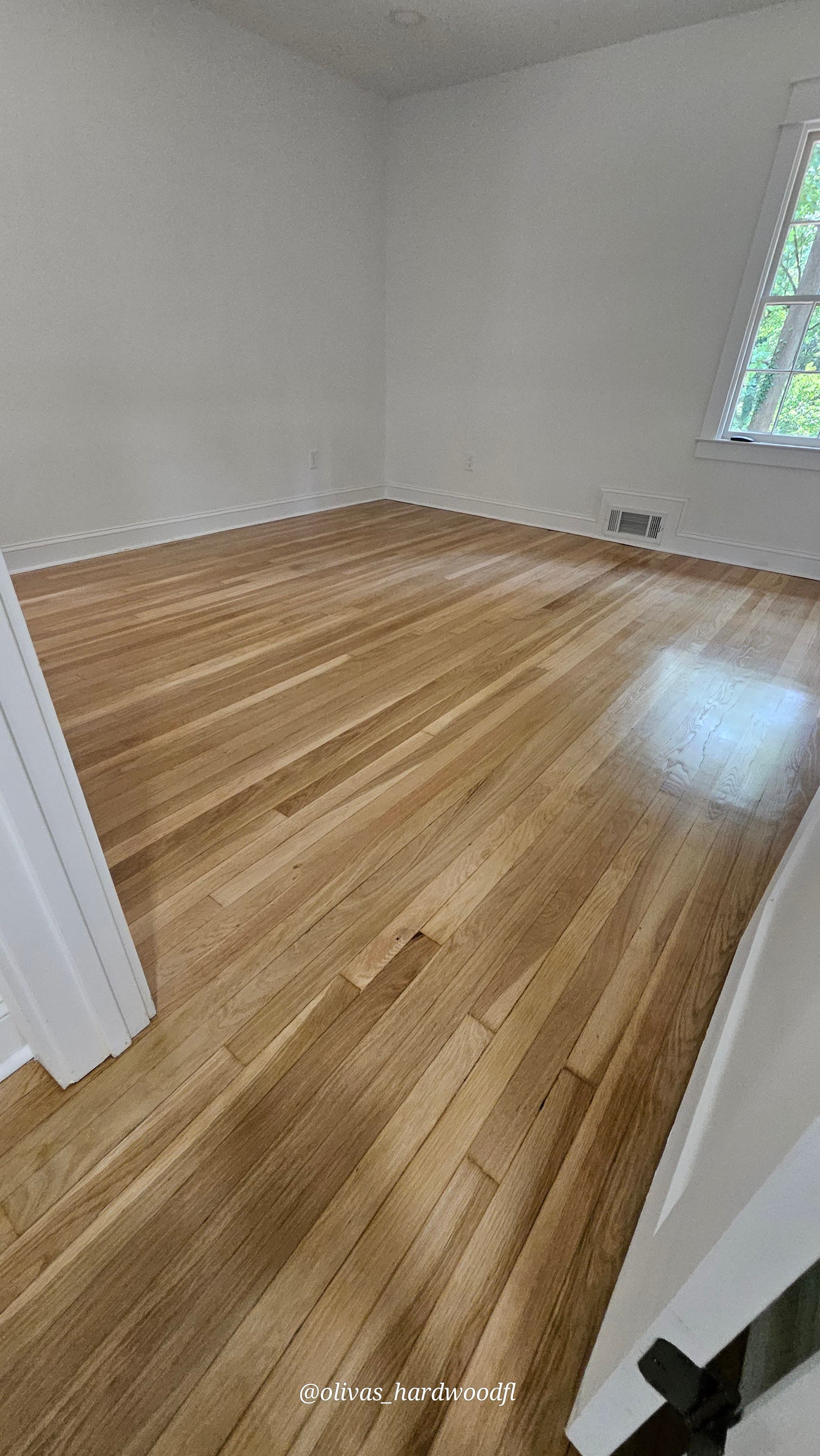 Hardwood floor refinishing in Roswell GA — natural honey oak bedroom floors after refinishing