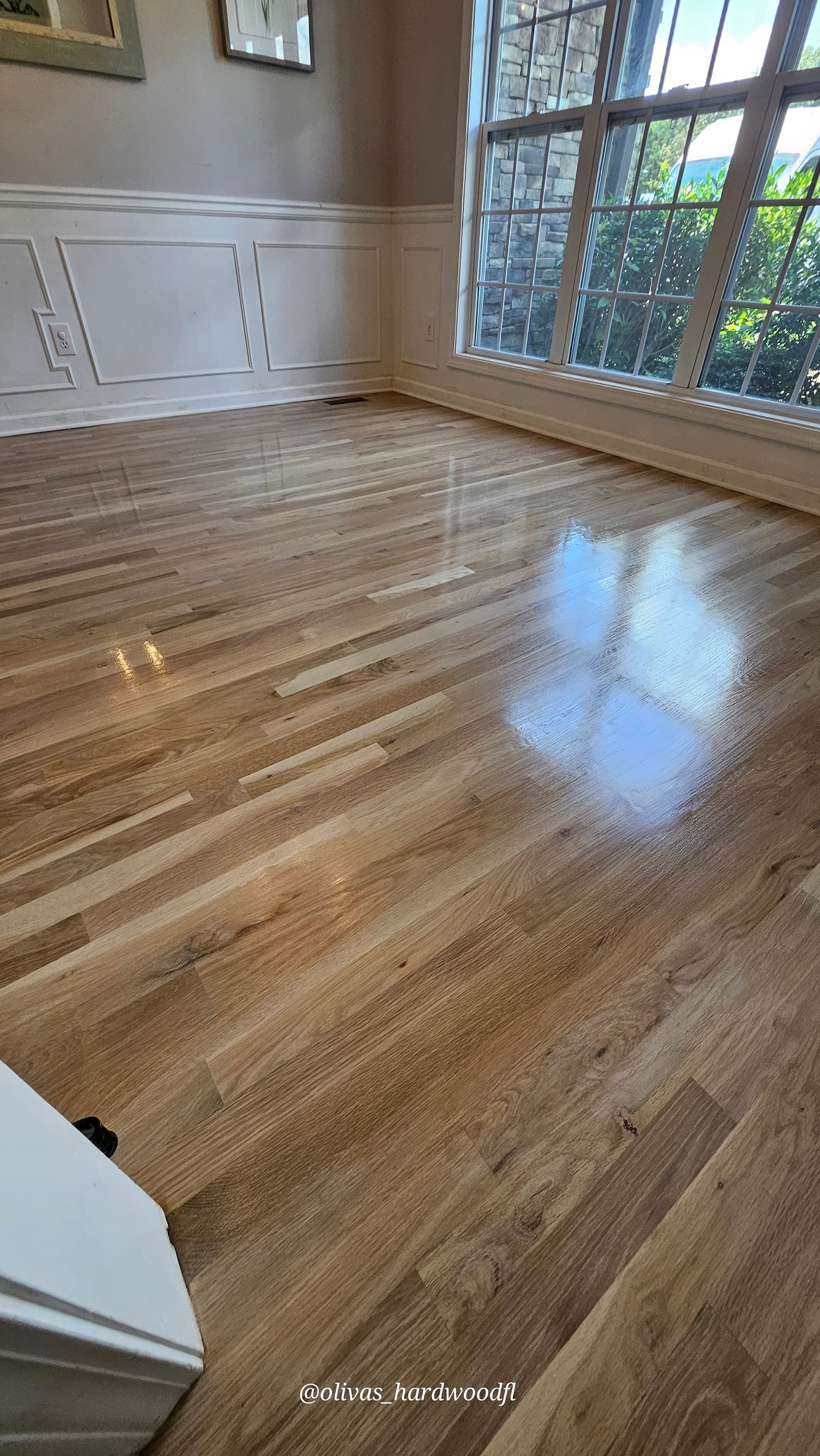Hardwood floor refinishing in Gwinnett County GA — natural white oak satin finish dining room with wainscoting