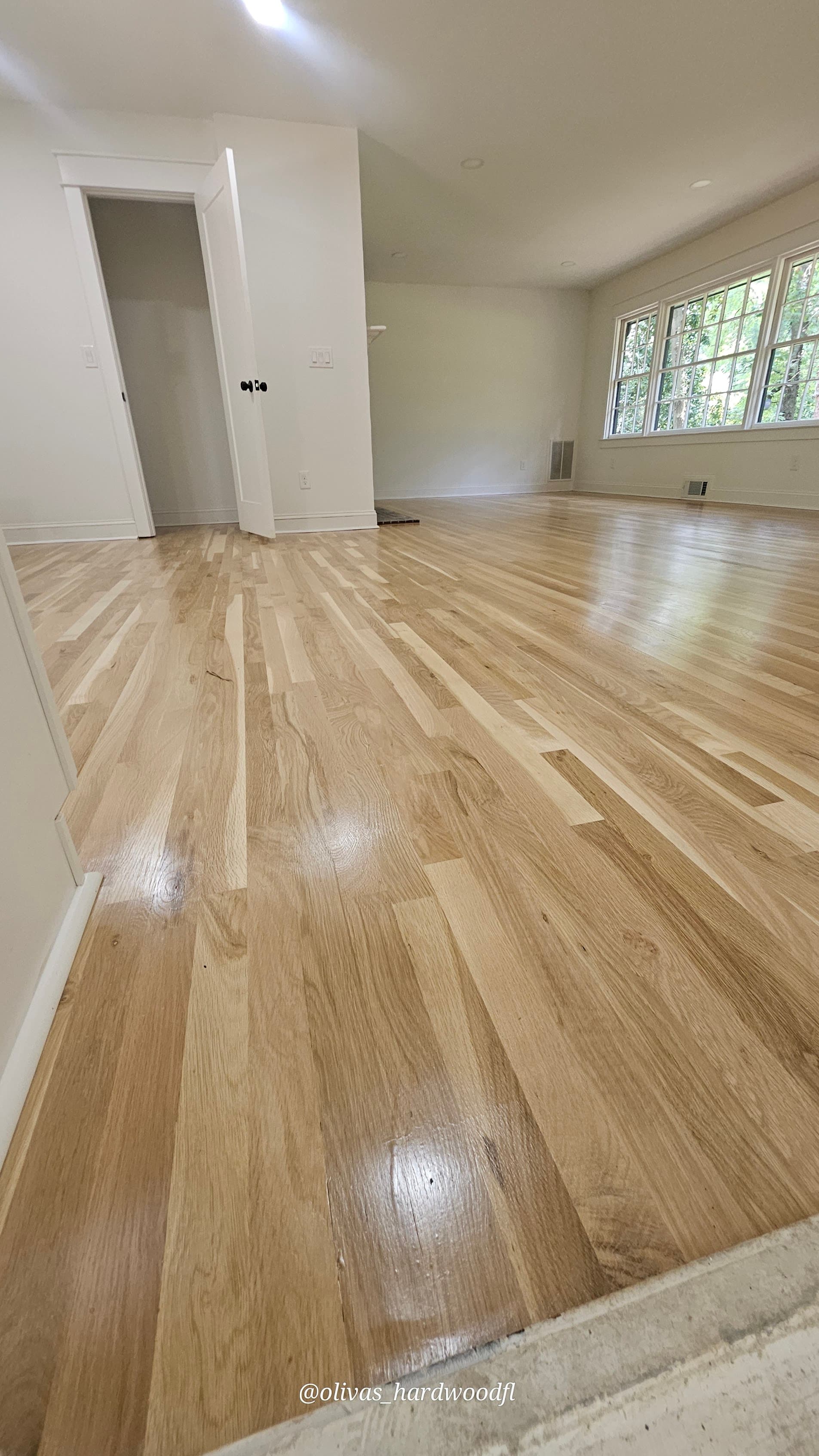 Hardwood floor refinishing in Lawrenceville GA — natural white oak high-gloss bonus room