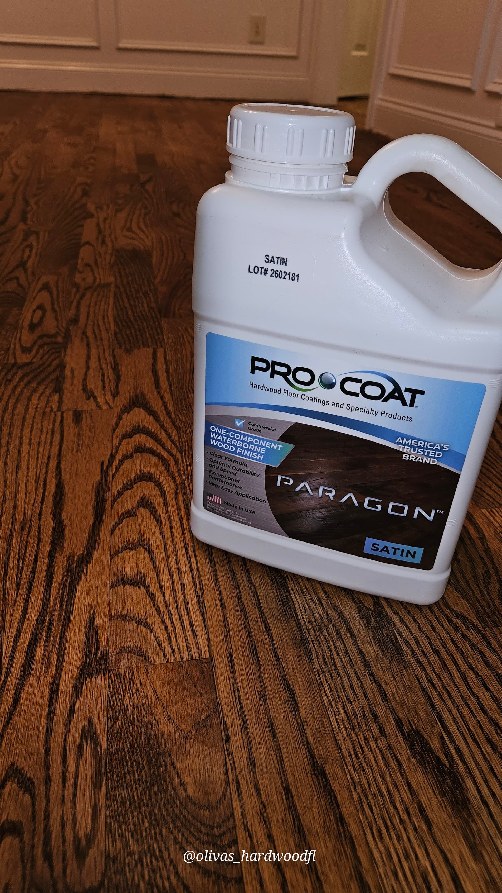 Hardwood floor refinishing in Lawrenceville GA — ProCoat Paragon satin finish applied to dark stain oak floors