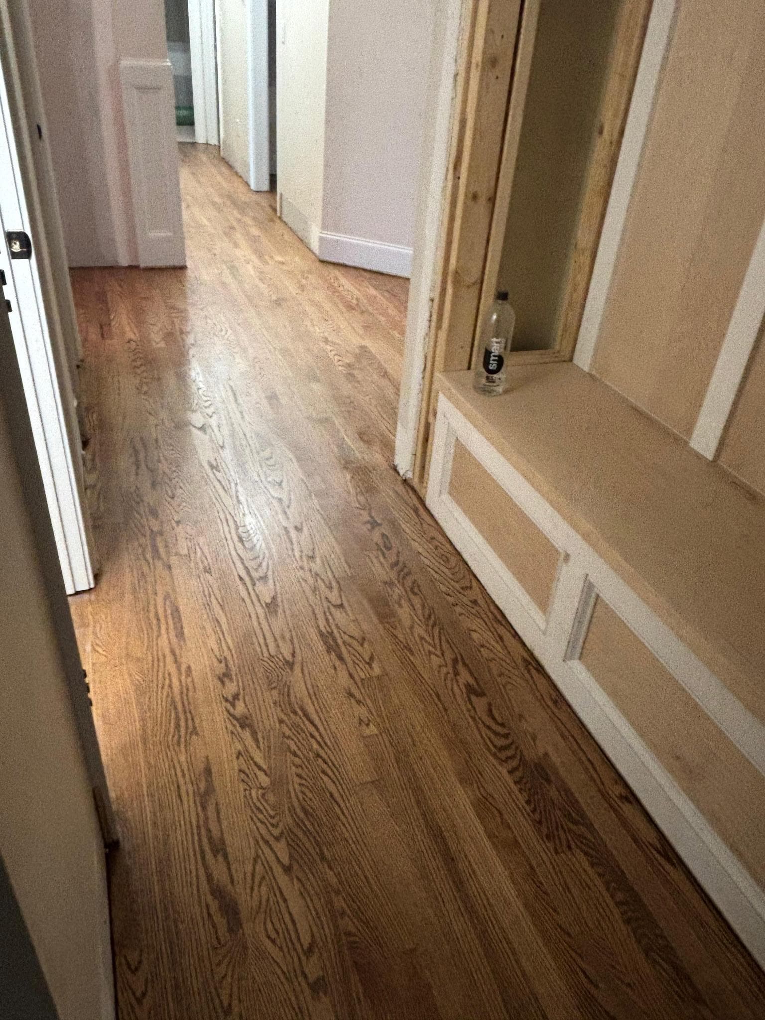 Hardwood floor refinishing in Atlanta GA — natural honey oak hallway after professional refinishing