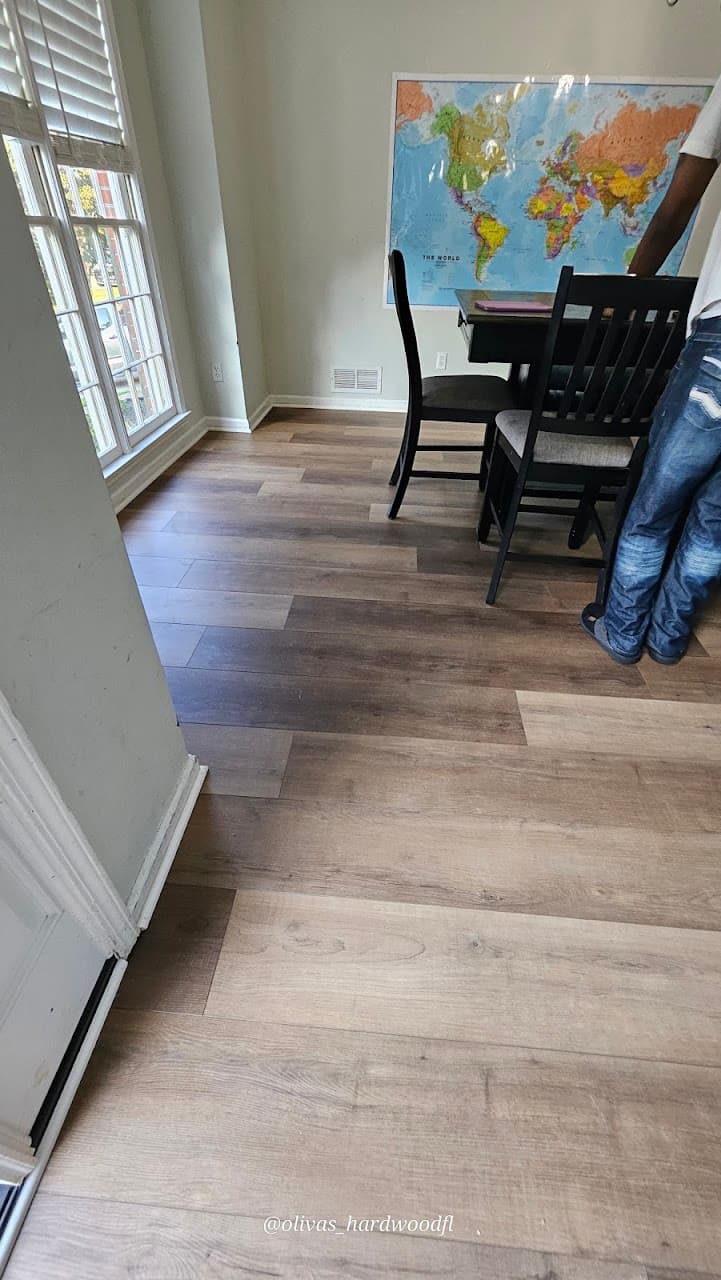 Luxury vinyl plank flooring in Decatur GA — gray-brown LVP installed throughout open living and dining area