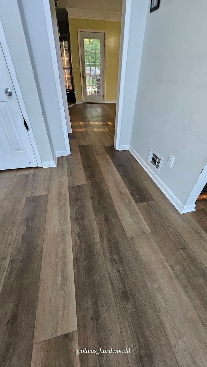 Luxury vinyl plank flooring in Lawrenceville GA — gray-brown LVP hallway installation