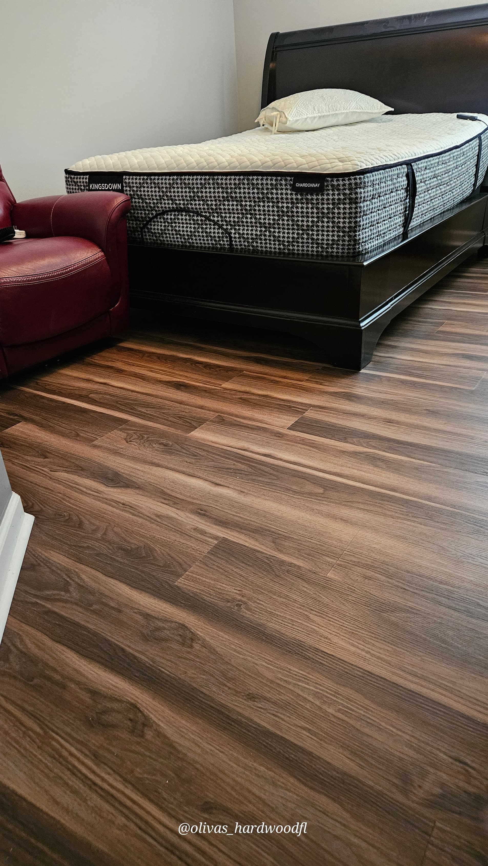 Luxury vinyl plank flooring in Duluth GA — dark walnut LVP bedroom installation