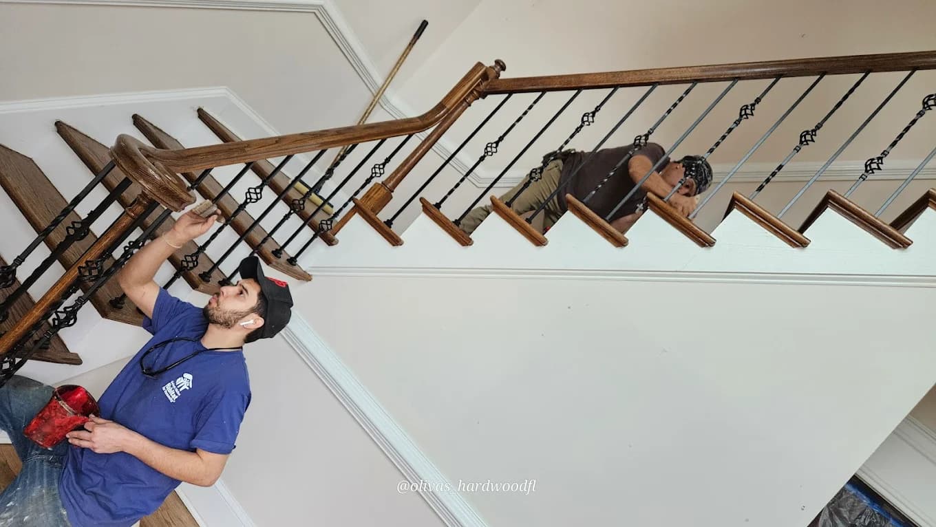 Custom staircase renovation in Metro Atlanta GA — refinished oak treads white risers