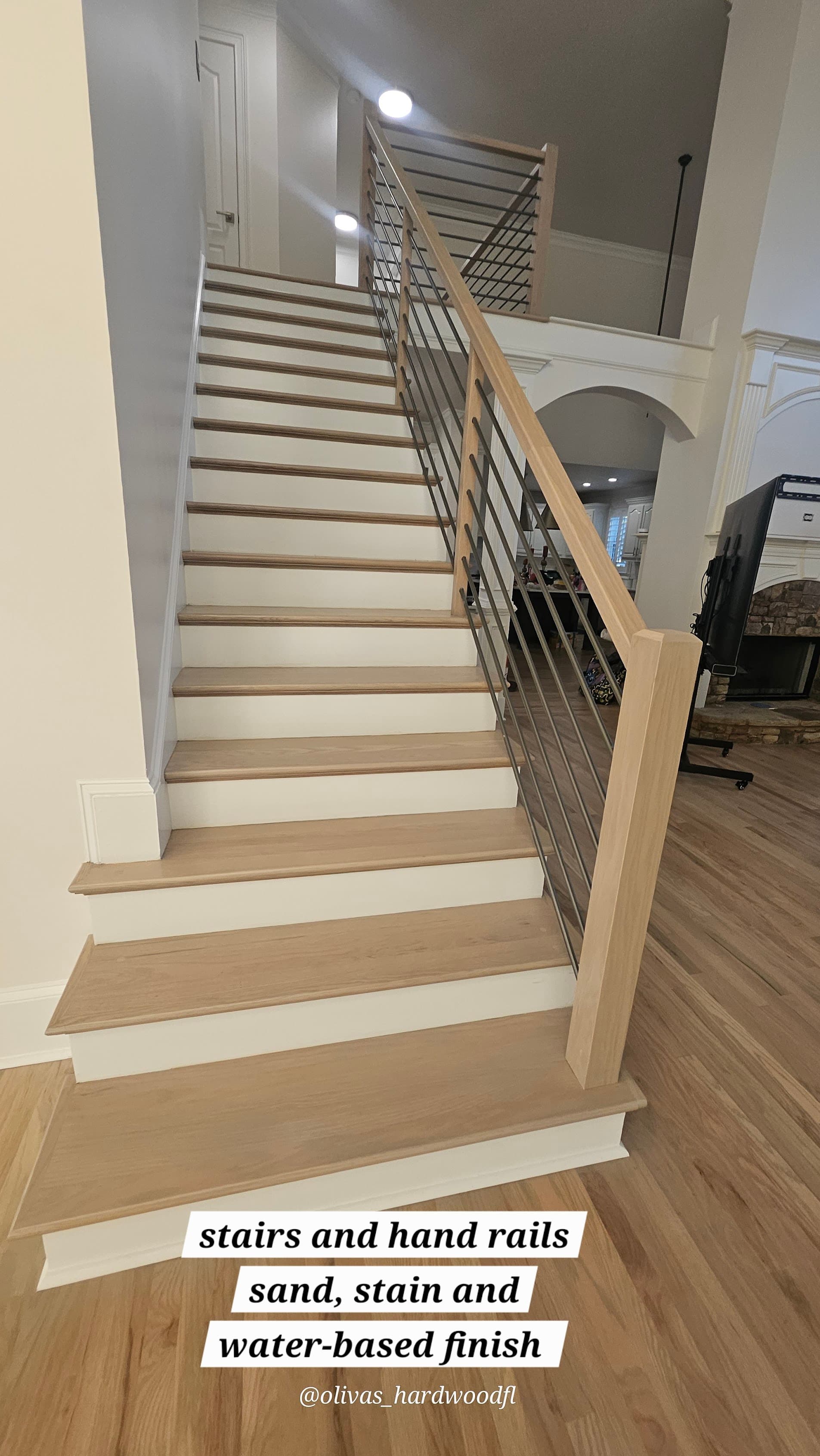 Staircase renovation in Marietta GA — natural oak treads sanded and stained with water-based finish and modern rod balusters