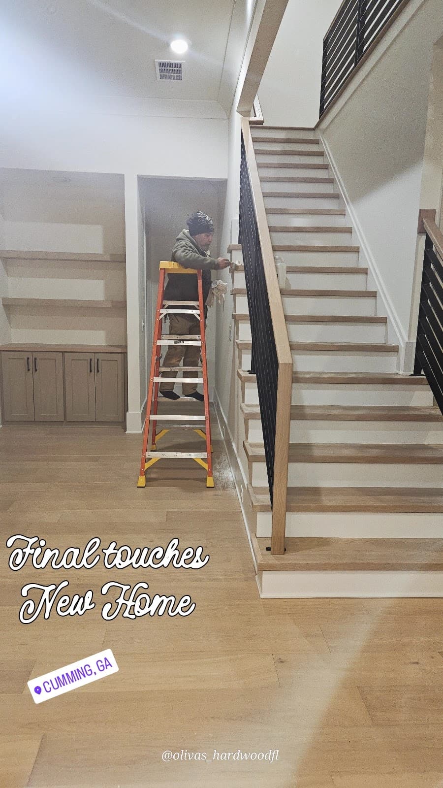 Staircase renovation in Cumming GA — natural oak treads installed in new construction home